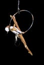 Girl gymnast in the circus. Aerial ring. Russian Circus. A gymnast under the dome of a circus.