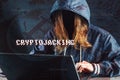 Girl hacker without a face is trying to steal cryptocurrency using a computer. Fraud and scam at Cryptojacking