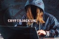 Girl hacker without a face is trying to steal cryptocurrency using a computer. Fraud and scam at Cryptojacking Royalty Free Stock Photo