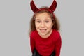 Girl in halloween costume and devil`s horns Royalty Free Stock Photo