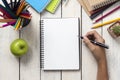 Girl hand drawing, blank paper and colorful pencils on white wooden table Royalty Free Stock Photo