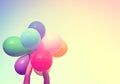 Girl hand holding multi colored balloons Royalty Free Stock Photo