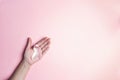 Girl hand holding pink breast cancer awareness ribbon.Copy space Royalty Free Stock Photo