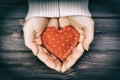 Girl hand holding red heart shape vintage tone Royalty Free Stock Photo