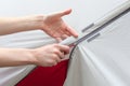 Girl hand unzip the entry of camping tent on rainfly. Royalty Free Stock Photo