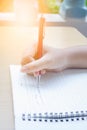 Girl hand writing on blank white book Royalty Free Stock Photo