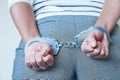 The girl in handcuffs at the police station. Arrested for misdemeanors Royalty Free Stock Photo