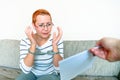 The girl in handcuffs reads the arrest warrant. Arrested for misdemeanors Royalty Free Stock Photo