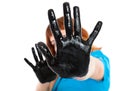 Girl with hands in black paint Royalty Free Stock Photo
