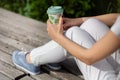 Coffee Break in the Park: Stylish Woman Enjoying a Cup of Coffee on a Sunny Spring Day Royalty Free Stock Photo