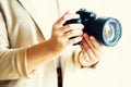 Girl hands holding photo camera, white background, copy space. Travel and shoot concept Royalty Free Stock Photo