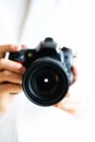 Girl hands holding photo camera, white background, copy space. Travel and shoot concept Royalty Free Stock Photo