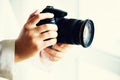 Girl hands holding photo camera, white background, copy space. Travel and shoot concept Royalty Free Stock Photo