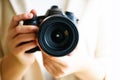 Girl hands holding photo camera, white background, copy space. Travel and shoot concept Royalty Free Stock Photo