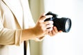 Girl hands holding photo camera, white background, copy space. Travel and shoot concept Royalty Free Stock Photo