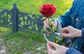 The girl uses a key to free the guy`s hands from the handcuffs Royalty Free Stock Photo