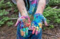 A girl hands painted in various colors, creative world art pic