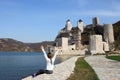 The girl with hands up looks at the Golubac fortress