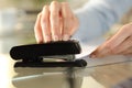 Girl hands using stapler on documents over a desk at home Royalty Free Stock Photo