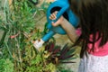 Girl hands watering plants
