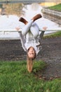 Girl hanging on banisters