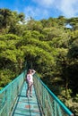 Girl on hanging bridge in cloudforest - Monteverde, Costa Rica Royalty Free Stock Photo