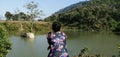 A Girl hanging out near a pond at sikuni tea estate area.