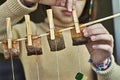 Girl hanging used tea bags for second use Royalty Free Stock Photo