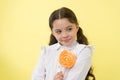 Girl happy face holds sweet lollipop ok gesture. She deserved candy. Girl likes sweet candy yellow background