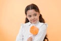 Girl happy face holds sweet lollipop ok gesture. She deserved candy. Girl likes sweet candy yellow background