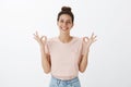 Girl happy finally everything okay posing relieved and joyful standing carefree over grey wall with orbs, showing ok