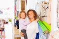 Girl with happy mother holding bags while shopping Royalty Free Stock Photo