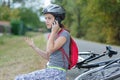 Girl that has bike accident calling on phone Royalty Free Stock Photo