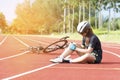 Girl has sport accident injury at her knee from bicycle, Sport and Accident concept Royalty Free Stock Photo