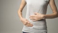 Woman having painful stomachache. Chronic gastritis. Abdomen bloating concept Royalty Free Stock Photo