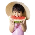 Girl with hat eats watermelon in studio Royalty Free Stock Photo