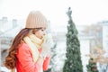 The girl in the hat froze and drinking hot tea