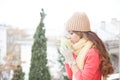 The girl in the hat froze and drinking hot tea Royalty Free Stock Photo