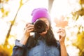 Girl in hat with professional camera on fall season park Royalty Free Stock Photo