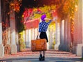 Girl in hat and shirt with suitcase in red grape alley Royalty Free Stock Photo