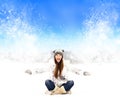 Girl in hat sitting on the snow Royalty Free Stock Photo