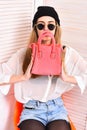 Girl in hat and sunglasses with confident face Royalty Free Stock Photo