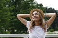 Girl in hat on vacation in park