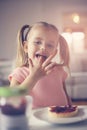 Girl having breakfast. Close up image. Royalty Free Stock Photo