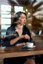 Girl having coffee in the bar Royalty Free Stock Photo