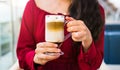 Girl having a cup of coffee in a bar Royalty Free Stock Photo