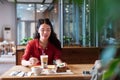 Girl having a cup of coffee and cake Royalty Free Stock Photo