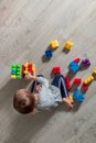 girl having fun and build of bright plastic construction blocks Royalty Free Stock Photo