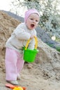 Girl having fun playing in sand Royalty Free Stock Photo
