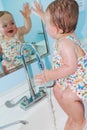 Girl having fun in sink Royalty Free Stock Photo